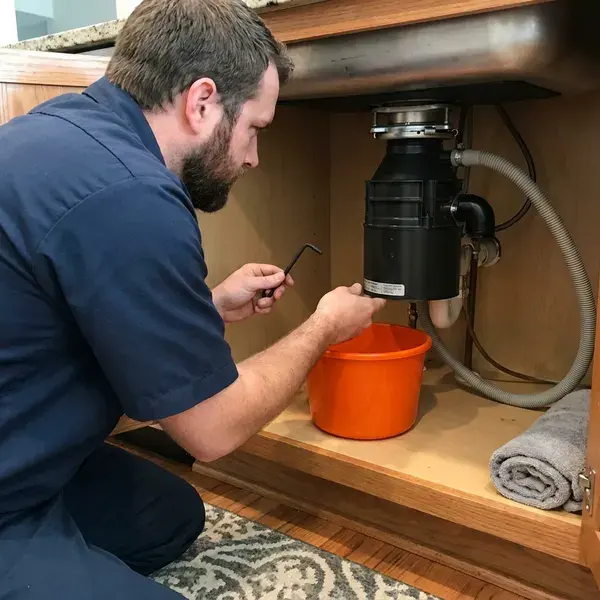FKM Plumbing technician providing garbage disposal repair in Los Angeles, CA